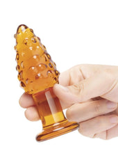 artisan crafted glass butt plug featuring tapered tip and corn kernel texture for added sensation