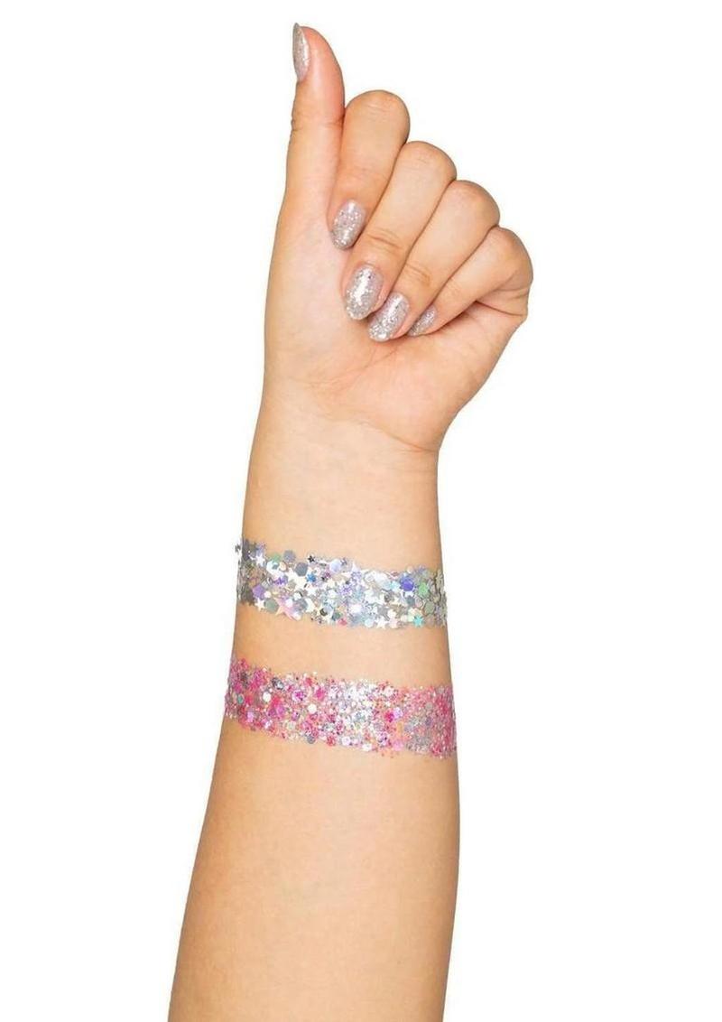 Hand wearing two glittery wristbands on a white background
