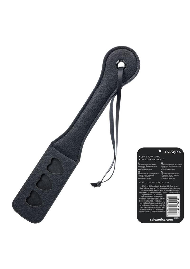 black and red heart shaped paddle delivering playful romantic spanks for couples and fetish scenes