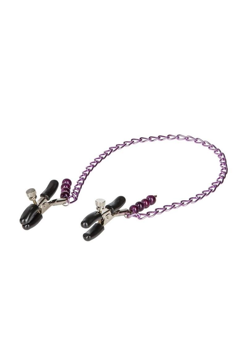 Nipple clamps on a chain for nipple torture