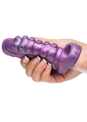 Monster-themed silicone enhancer sleeve with soft texture, suction detail, and squirting system for fantasy pleasure