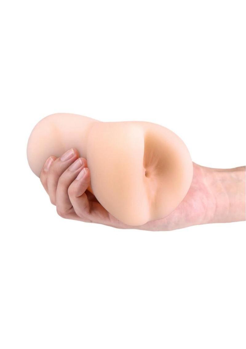 stroker toy held in hand for scale