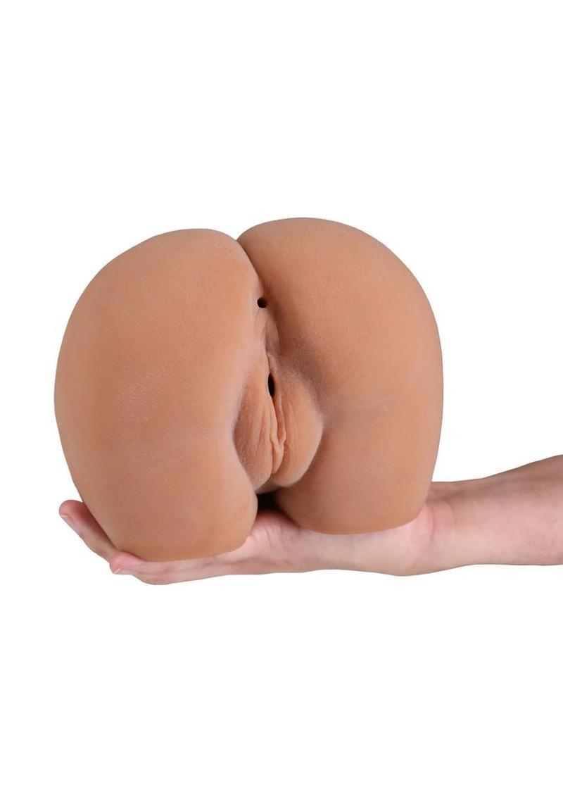 stroker toy held in hand for scale