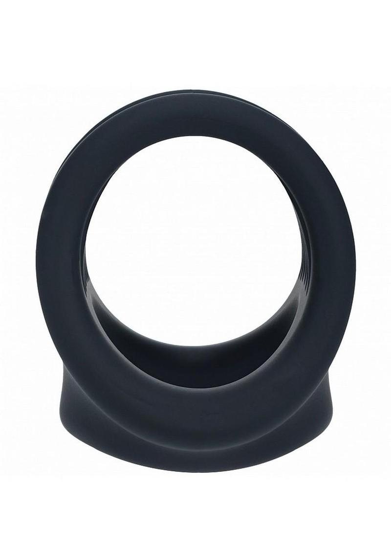 close up of thick black silicone cock and ball harness highlighting smooth flexible design