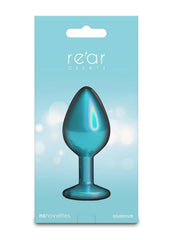 Elegant anal plug styled on satin fabric highlighting chrome finish and smooth contours