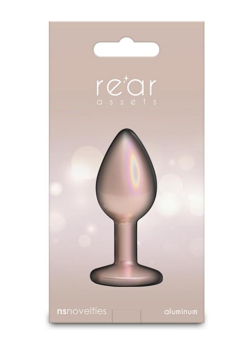 Sparkling champagne-colored anal toy displayed for sensual photography and intimate appeal