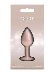 Sparkling champagne-colored anal toy displayed for sensual photography and intimate appeal