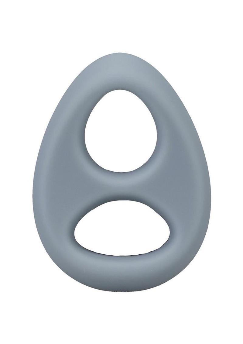 Gray plastic ring with two circular holes on a white background Cock and Ball torture