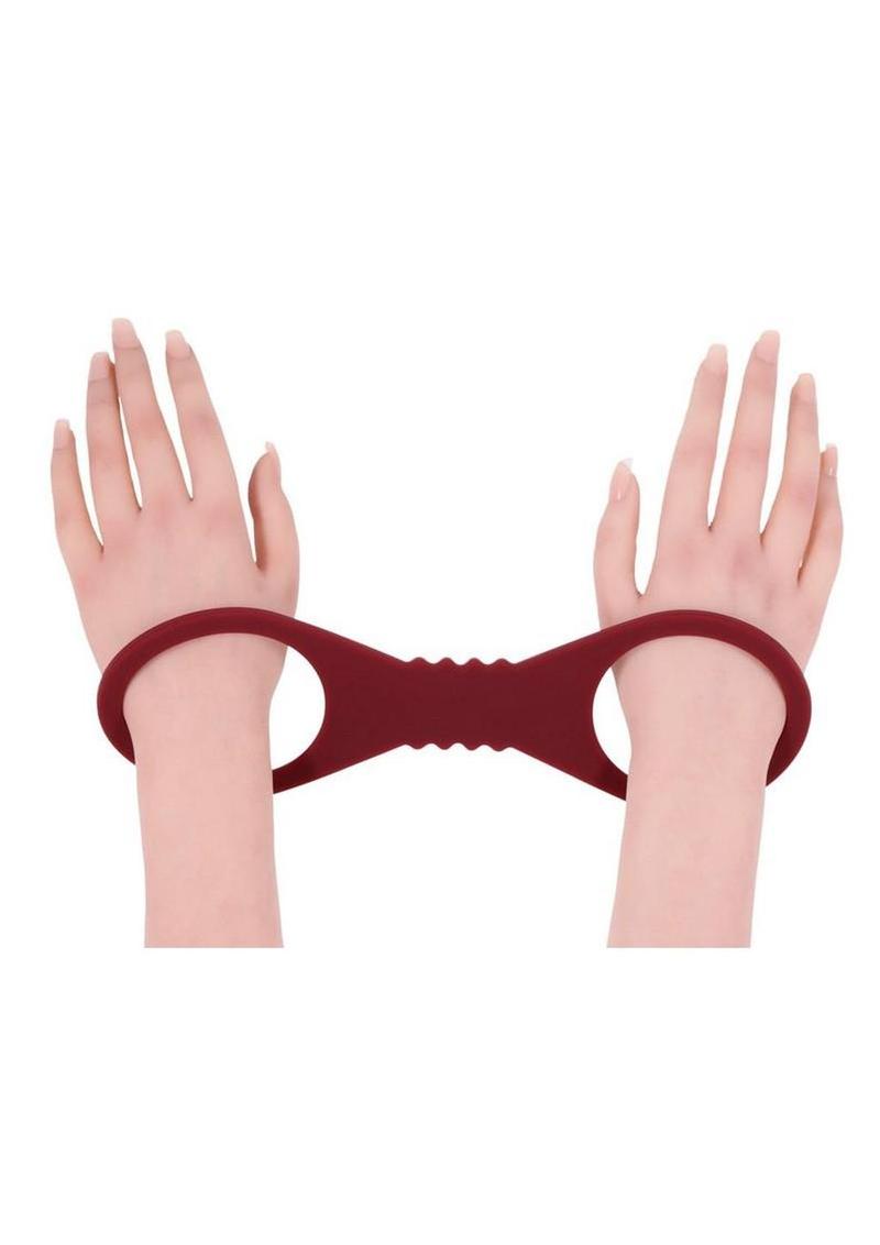 ergonomic silicone cuffs in burgandy  offering flexible restraint and secure bdsm play