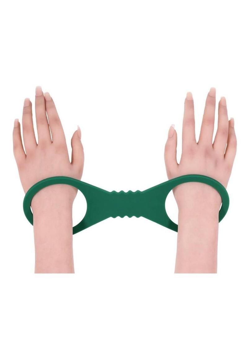 soft stretch silicone cuffs in bold green for secure restraint play sliding on and off easily for simple bdsm sessions and pleasure control