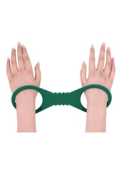 soft stretch silicone cuffs in bold green for secure restraint play sliding on and off easily for simple bdsm sessions and pleasure control