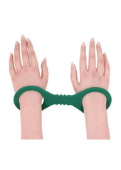 soft green silicone cuffs that slide on easily for simple bdsm restraint comfortable control and bondage pleasure