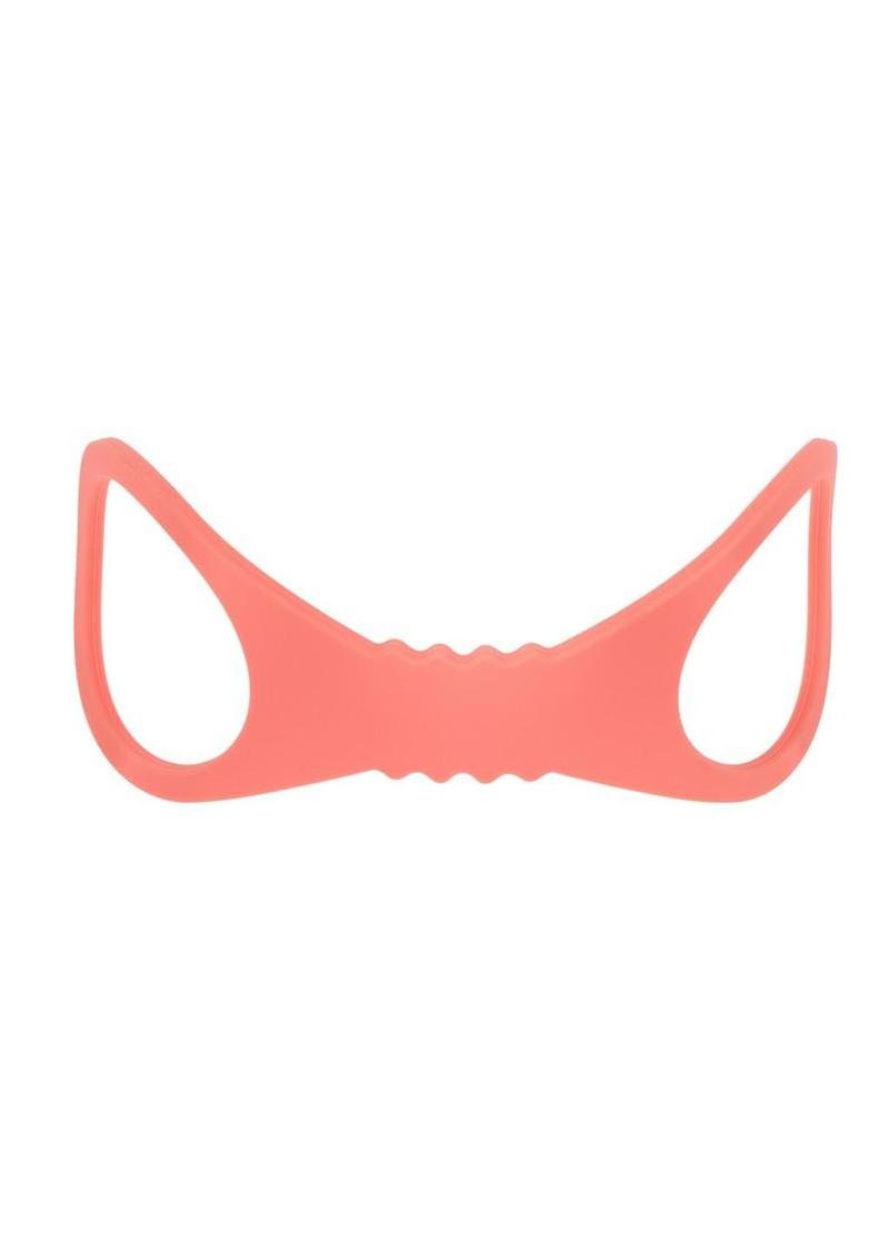 Soft silicone wrist cuffs in peaches and cream color for playful bondage, comfortable restraint, and beginner friendly bedroom fun