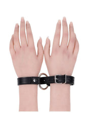 Black faux leather restraint cuffs for couples
