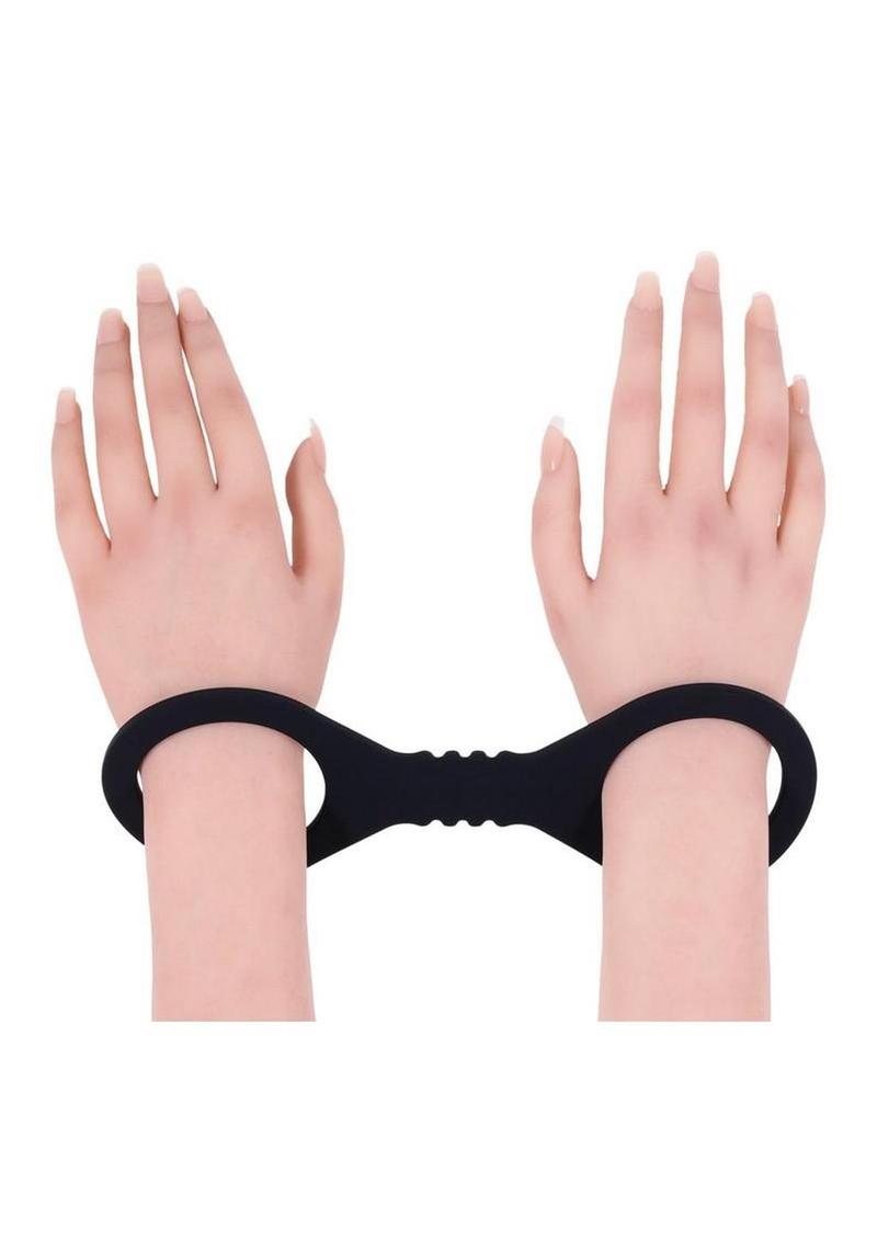 silicone bondage cuffs in black with smooth stretch material for secure comfortable restraint and bdsm control play