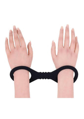 silicone bondage cuffs in black with smooth stretch material for secure comfortable restraint and bdsm control play