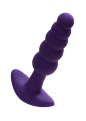 Purple silicone butt plug on a white background
