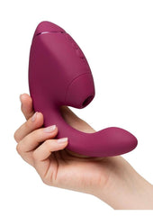Soft body-safe silicone toy combining suction and vibration designed to deliver powerful blended orgasms for women
