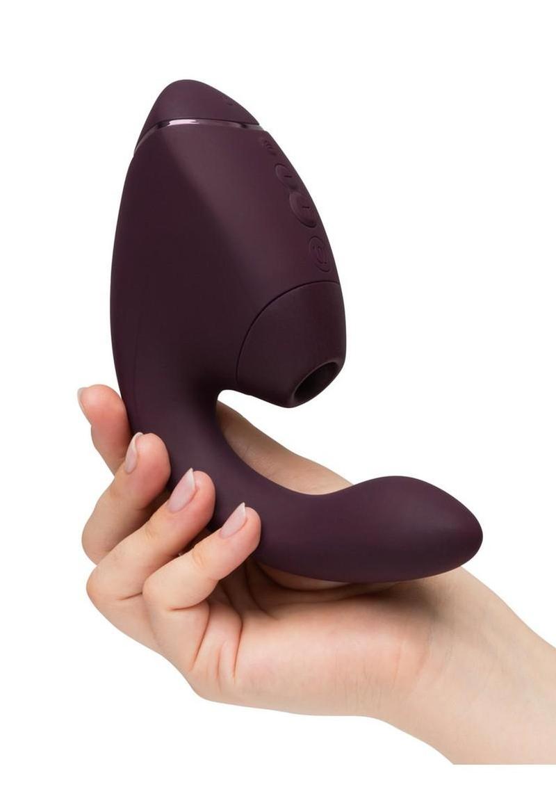 Silicone dual stimulator with curved internal arm and suction tip providing intense simultaneous stimulation for her